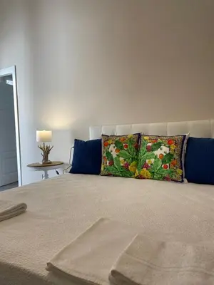 a bedroom with a bed with a pillow on it at Domus Federiciana in Castellammare del Golfo