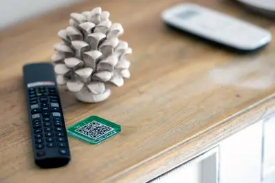 a remote control and a pineapple on a table at Domus Federiciana in Castellammare del Golfo