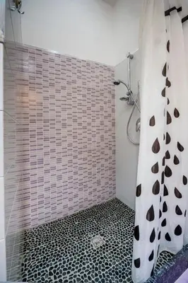 a bathroom with a shower with a shower curtain at Le Case di Katy in Castellammare del Golfo