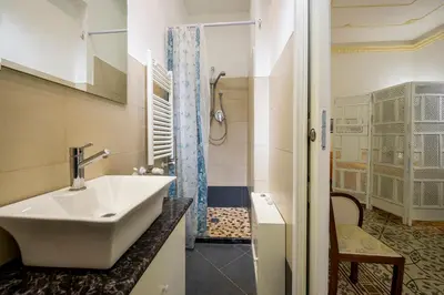 a bathroom with a sink and a shower at Le Case di Katy in Castellammare del Golfo