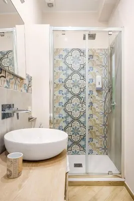 a bathroom with a white sink and a shower at Kalatafimi- Palermo Apartment 2 Camere & Wi-Fi in Palermo