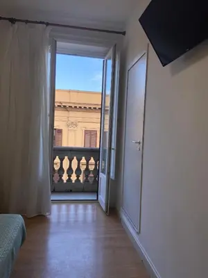 an open door to a room with a view at 38 Aira Hotels in Palermo