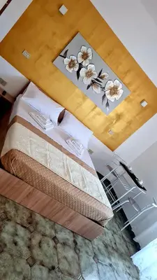 a bedroom with a bed with flowers on the ceiling at Le Terre di Sicilia in Terrasini