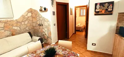 a living room with a couch and a table at Ai Normanni in Palermo