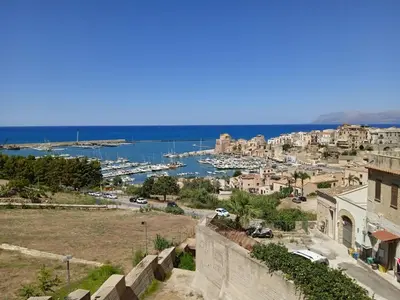 a view of a city with a harbor at Mary Gery's Rooms in Castellammare del Golfo
