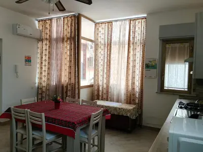 a bedroom with a mirror and a bed in it at Casa Donatella a Isola in Isola delle Femmine