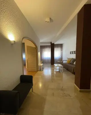 a large living room with a couch and a mirror at 100 PASSI Politeama in Palermo