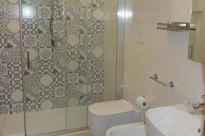 a bathroom with a shower and a toilet and a sink at I colori del mare in Macari