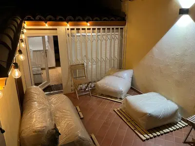 an attic room with two mattresses in plastic bags at Maquedino holiday home & Terrace - Cozy Central Loft in Palermo