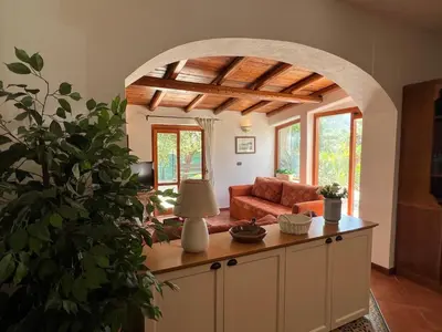 an archway in a living room with a couch at Villa Barone in Castellammare del Golfo