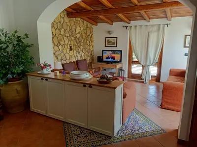 a living room with a table with plates on it at Villa Barone in Castellammare del Golfo
