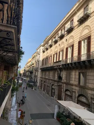 an empty street in a city with buildings at Bonorum Santa Sofia in Palermo