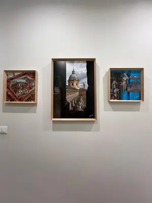 three photographs on a wall in a museum exhibit at Maqueda Suites in Palermo