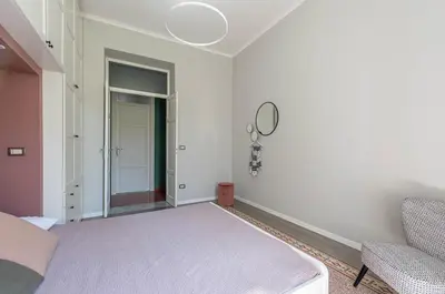 a kitchen with black and white cabinets and a window at Dante Design Apartment by Wonderful Italy in Palermo