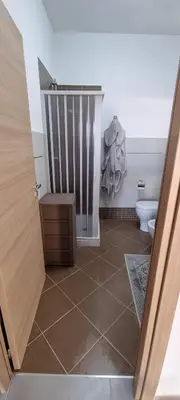 a bathroom with a shower and a toilet in a room at ADRIANA SEAHOUSE in Balestrate