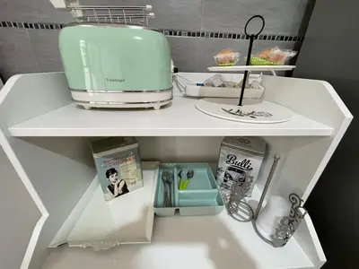 a kitchen shelf with a blender and other kitchen items at Casa vacanze Baglio Barcellona Mondello in Palermo
