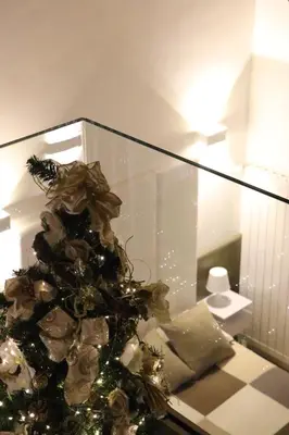 a christmas tree sitting on a counter in a room at meloluxuryhouse in Palermo