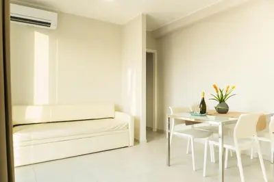 a living room with a couch and a table at Alba e Tramonto in San Vito lo Capo