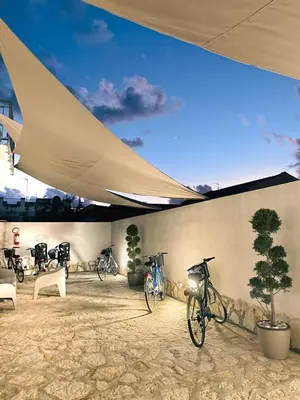 a group of bikes parked next to a wall at Alba e Tramonto in San Vito lo Capo