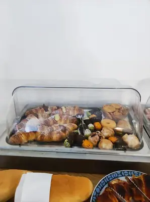 a tray of different types of food on a table at B&B Puvogel in Porticello
