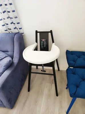 a white table next to a couch and a chair at B&B Puvogel in Porticello