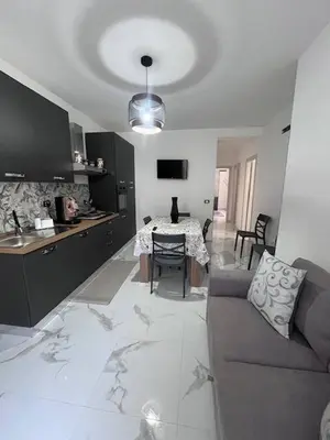 a room with a desk and a television on the wall at Makari Our Angel in Macari