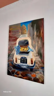 a painting of a car parked on the beach at Elenahouse alla Kalsa in Palermo