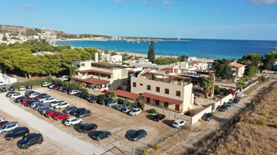 an aerial view of a parking lot with cars at Hotel Iride by Marino Tourist in San Vito lo Capo
