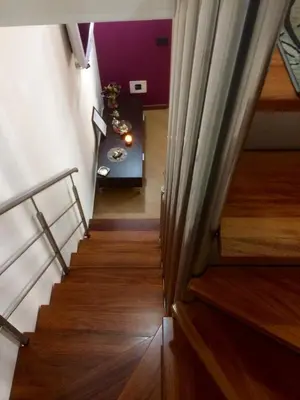 a view of a stairway with a table in a room at Casa Longo in Castellammare del Golfo