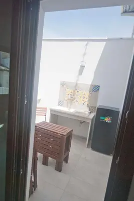 a room with a table and a bench and a window at GIADA in Castellammare del Golfo