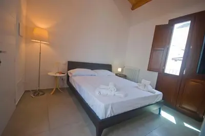 a bedroom with a bed with towels on it at GIADA in Castellammare del Golfo