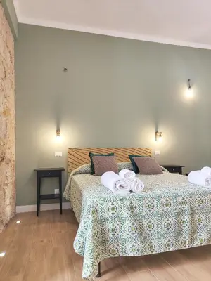 a bedroom with a bed with two towels on it at Dimora Carella Ai 5Venti in Palermo