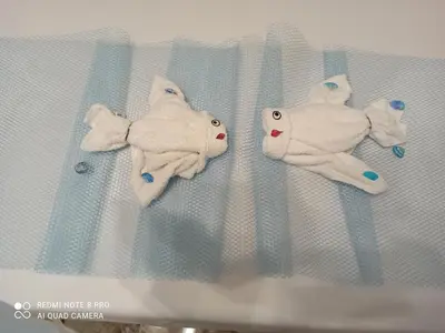 two stuffed animals are sitting on a crib at NARDINA HOUSE in Castellammare del Golfo