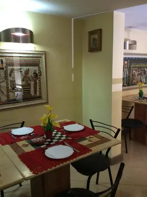 a dining room with a table and chairs at Albergo Verdi in Palermo