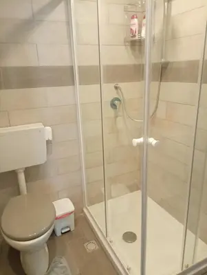 a bathroom with a shower and a toilet at Mi casa es tu casa in Palermo