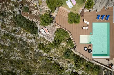 an overhead view of a swimming pool next to a house at Villa vista mare con piscina privata a Mondello in Palermo