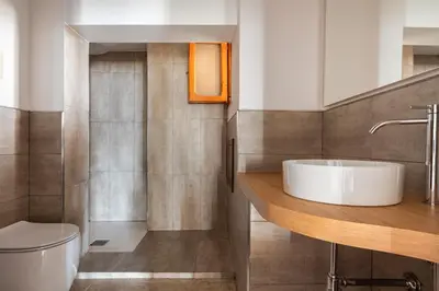 a bathroom with a sink and a toilet at Villa vista mare con piscina privata a Mondello in Palermo