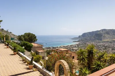 a view of the ocean from a hill at Villa vista mare con piscina privata a Mondello in Palermo