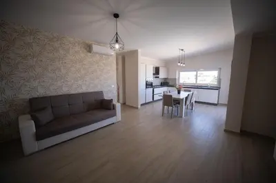 a living room with a couch and a table at Villa Lombardo Luxury in Balestrate