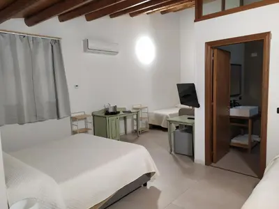 a bed with a tray with two plates of food on it at Villa Scaduto Residence in Bagheria