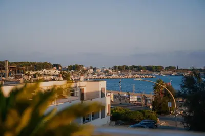 a view of a marina from a building at Hotel Piccolo Mondo in San Vito lo Capo