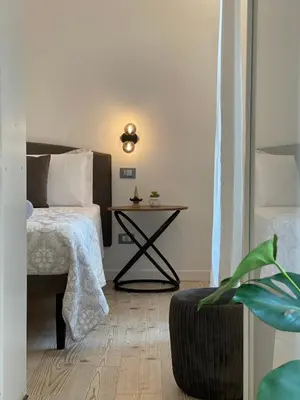 a bedroom with a large bed and a window at Maison Opéra in Palermo