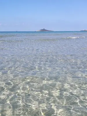 a large body of water with rocks in it at La Casa di Peppe in Capaci