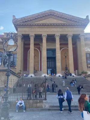 a group of people standing in front of a building at La Casa di Peppe in Capaci