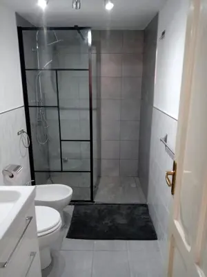 a bathroom with a shower with a toilet and a sink at Casa Repasi in Sferracavallo