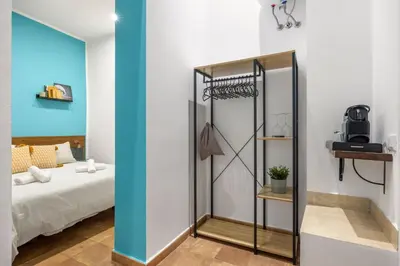 a room with a bed and a glass closet at Suk Ballarò in Palermo