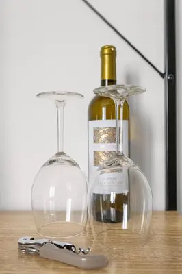 two wine glasses and a bottle on a table at Suk Ballarò in Palermo