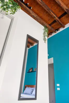 a mirror on the side of a room with a ceiling at Suk Ballarò in Palermo