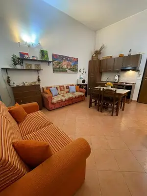 a living room with a couch and a table at Hola Cathedral House Cadorna in Palermo