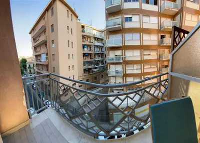 a balcony of a building with a spiral staircase at Casa Luminaria in Palermo